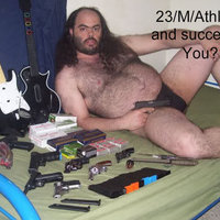 Fat hairy man in a speedo with guns and Guitar Hero controllers