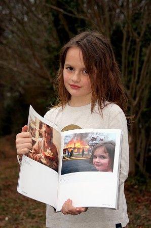 disaster-girl-with-her-photo.jpg